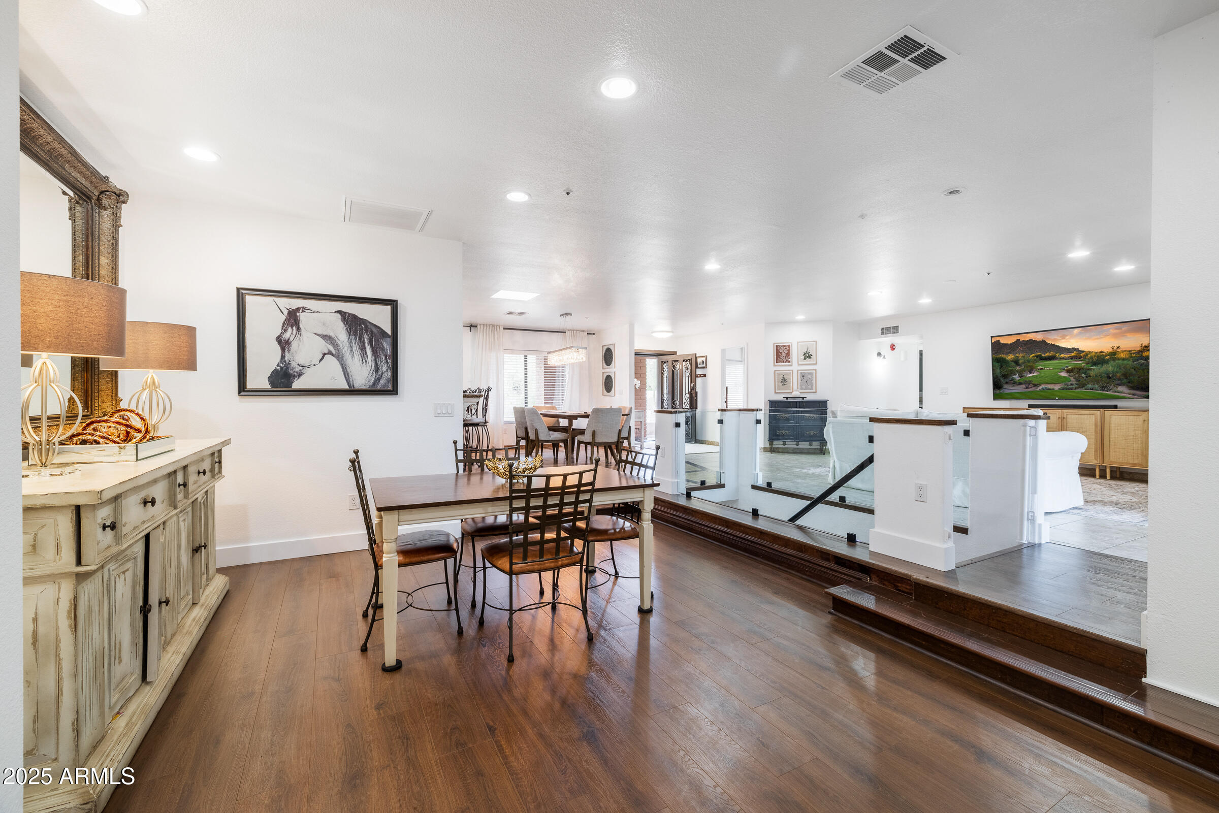 6835 East Peak View Road Scottsdale, AZ 85266 - Photo 12 of 107 a kitchen with stainless steel appliances granite countertop a table chairs refrigerator and sink
