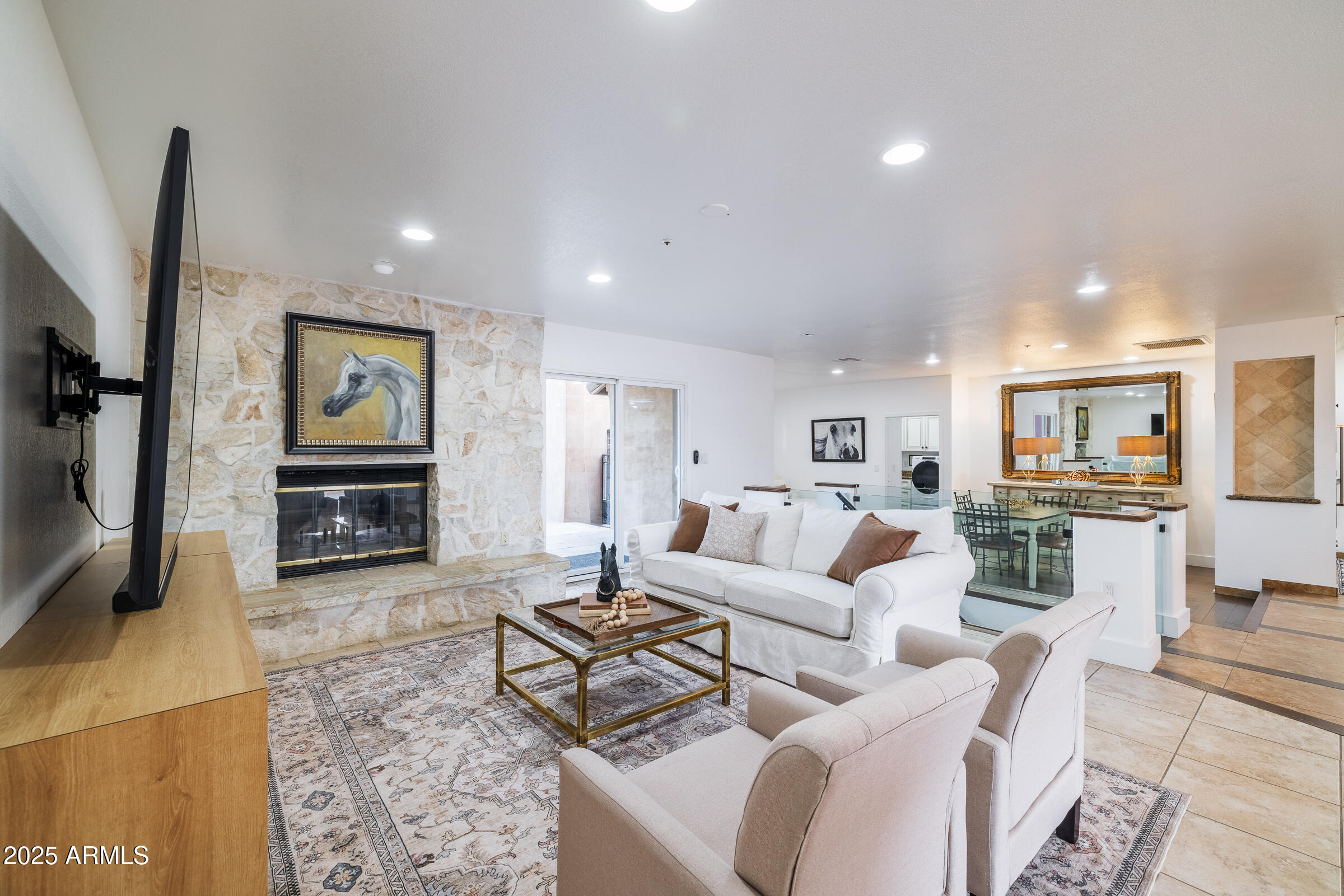 6835 East Peak View Road Scottsdale, AZ 85266 - Photo 14 of 107 a living room with fireplace furniture and a flat screen tv