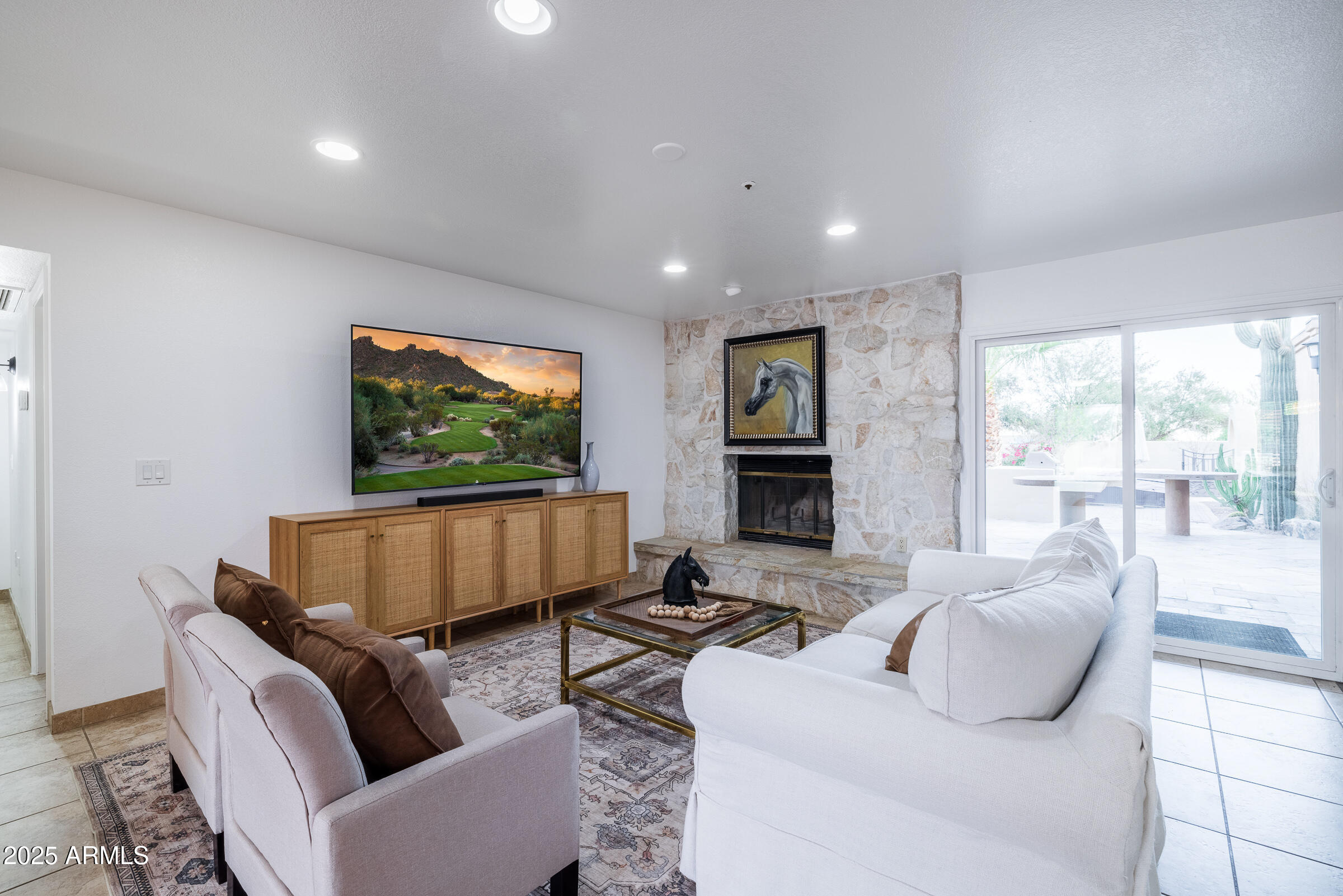 6835 East Peak View Road Scottsdale, AZ 85266 - Photo 15 of 107 a living room with furniture and a flat screen tv
