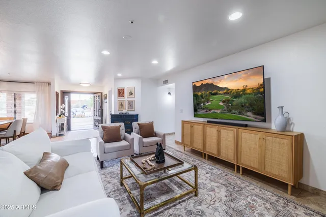 an aerial view of a house with a yard and lake view