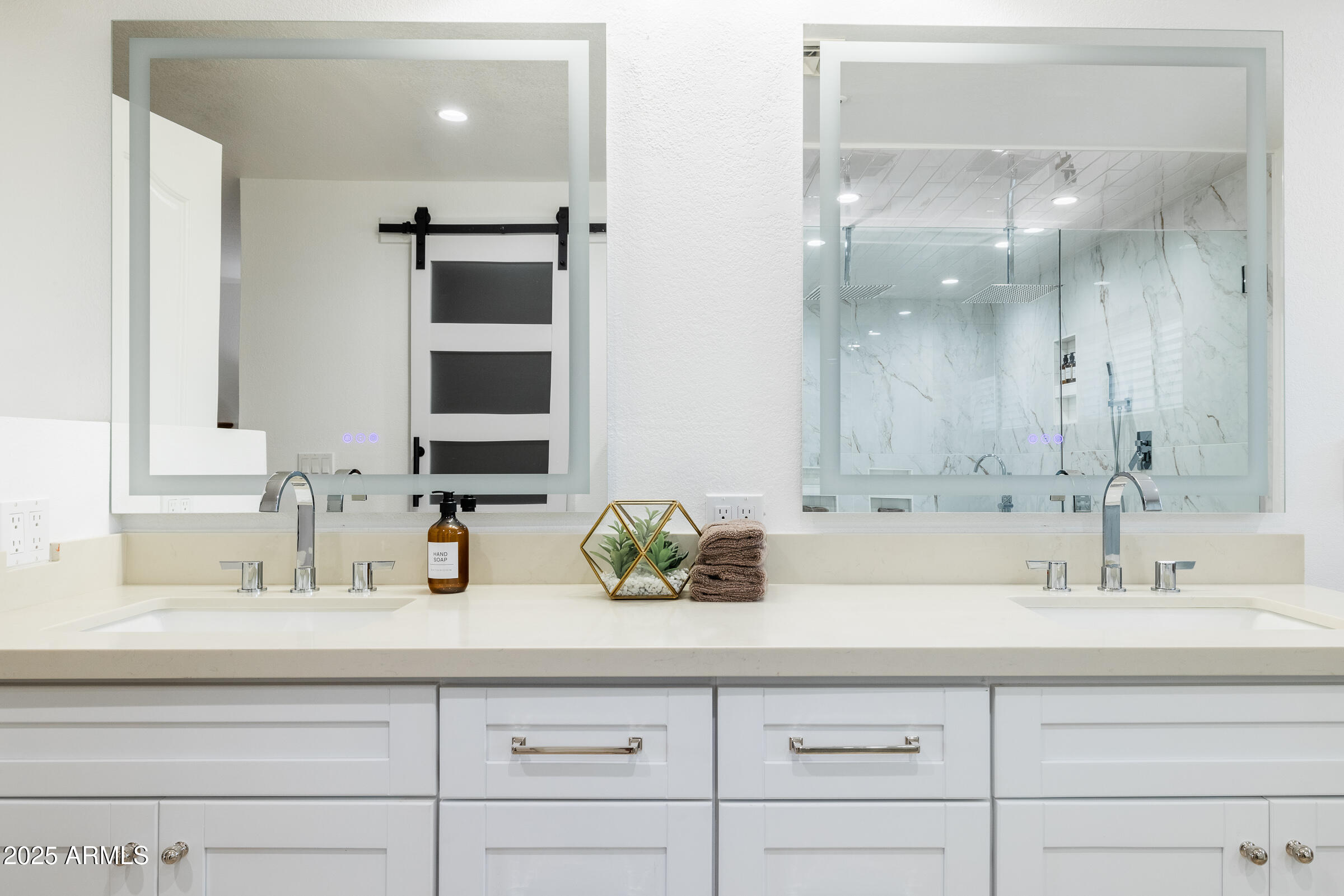 6835 East Peak View Road Scottsdale, AZ 85266 - Photo 25 of 107 a bathroom with double vanity sinks and a mirror