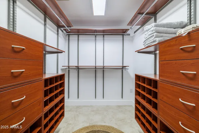 a bedroom with bed and a window