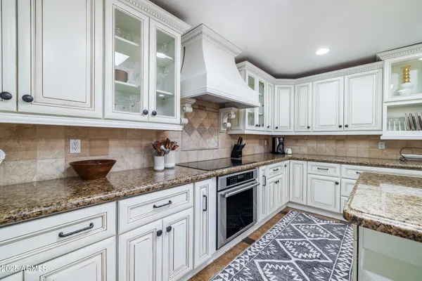 a living room with fireplace furniture and a flat screen tv