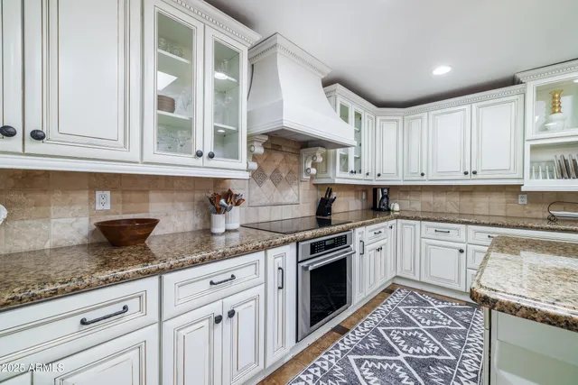 a living room with fireplace furniture and a flat screen tv