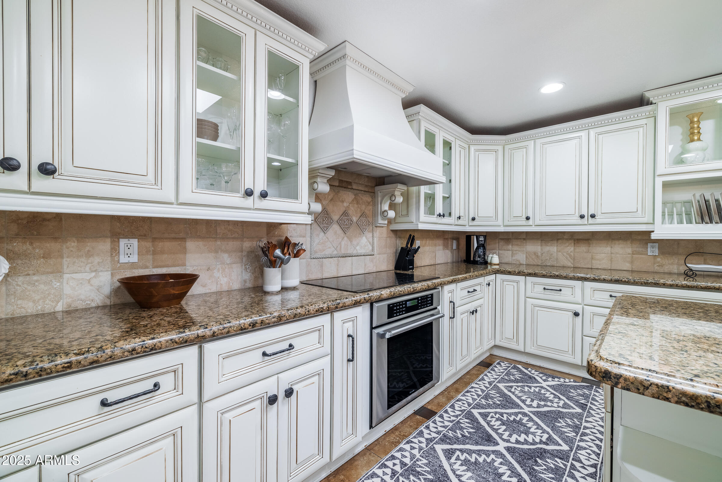 6835 East Peak View Road Scottsdale, AZ 85266 - Photo 5 of 107 a kitchen with granite countertop white cabinets stainless steel appliances a sink and a window