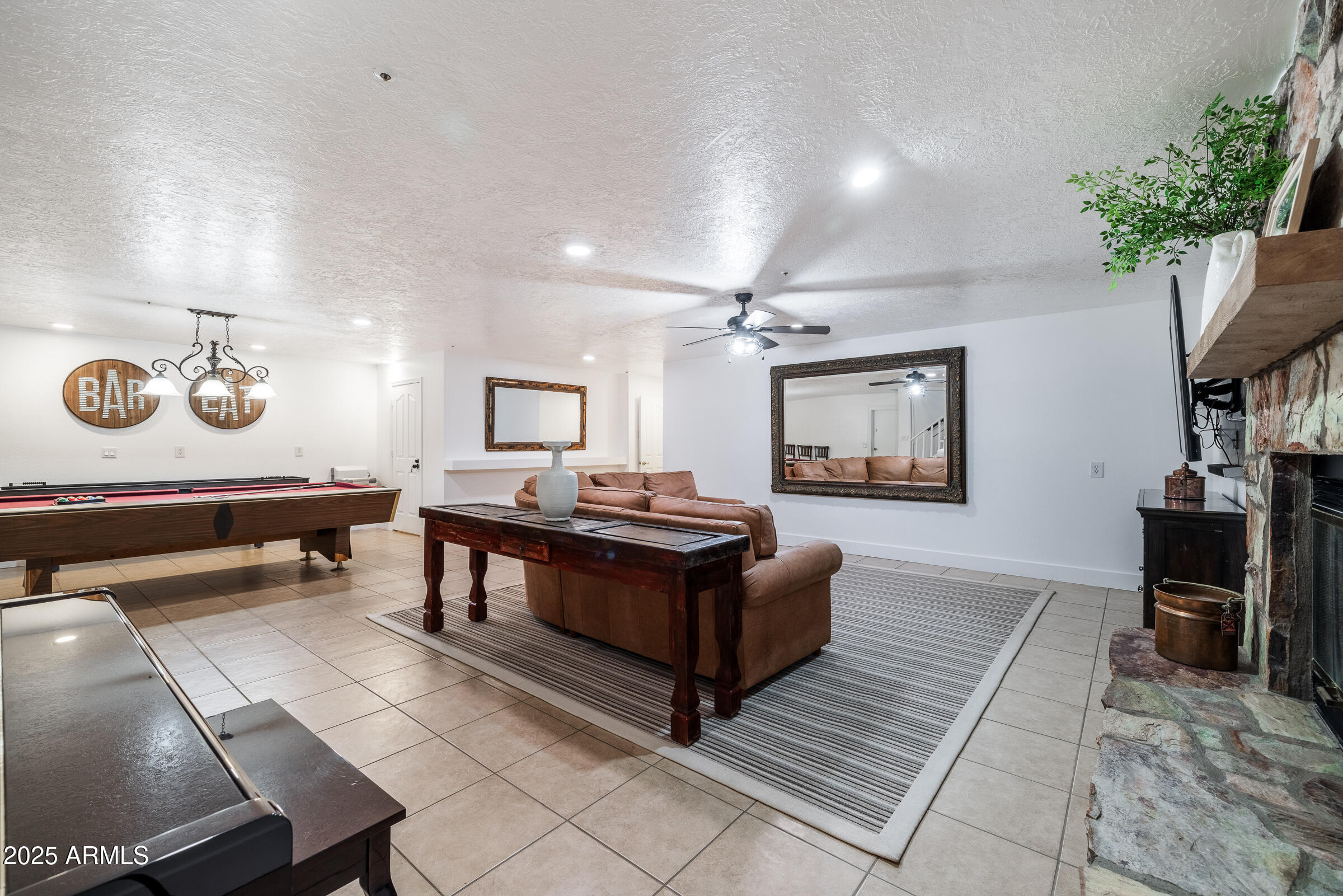 6835 East Peak View Road Scottsdale, AZ 85266 - Photo 67 of 107 a living room with furniture and a wooden floor