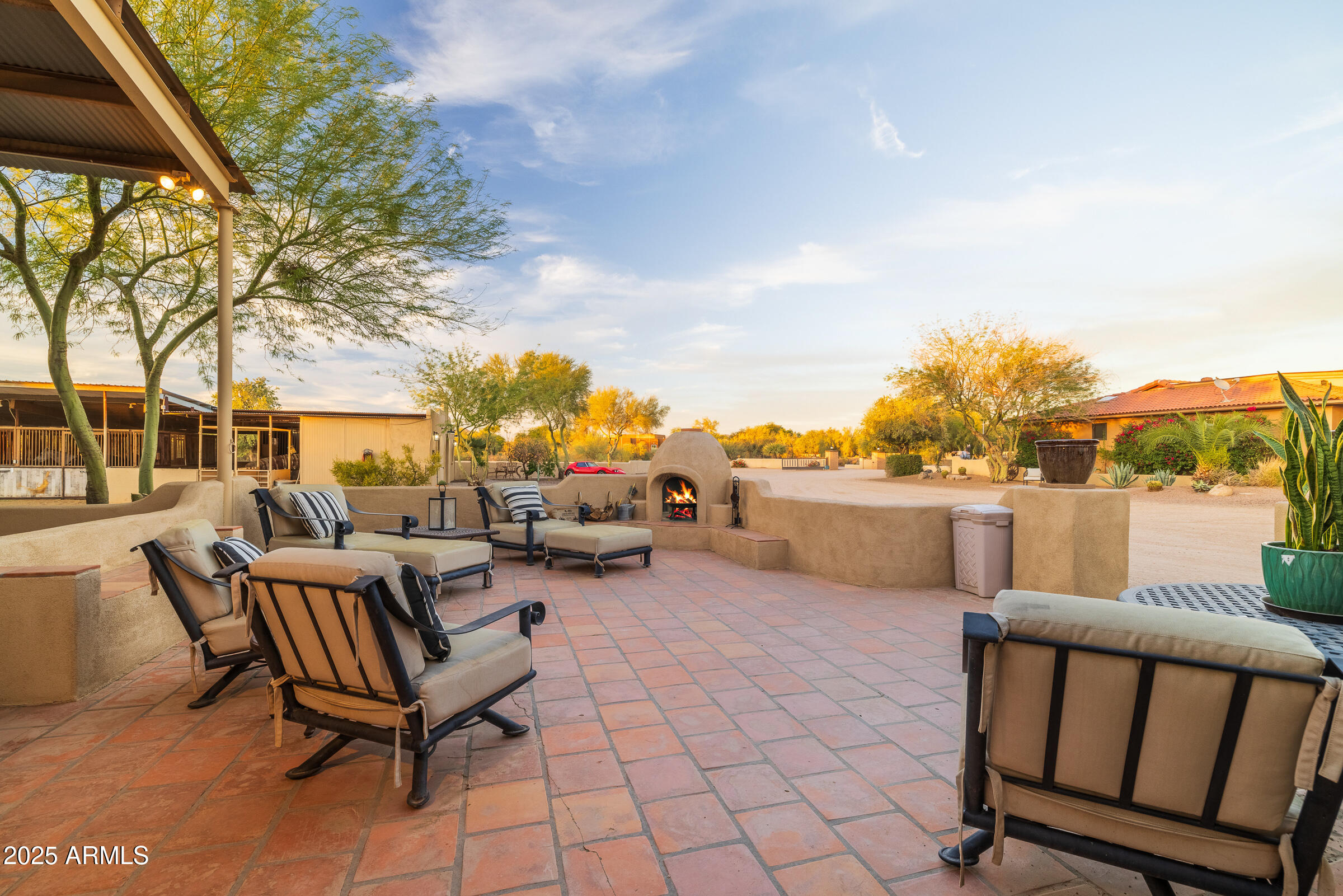 6835 East Peak View Road Scottsdale, AZ 85266 - Photo 80 of 107 a view of a terrace with furniture and a fire pit