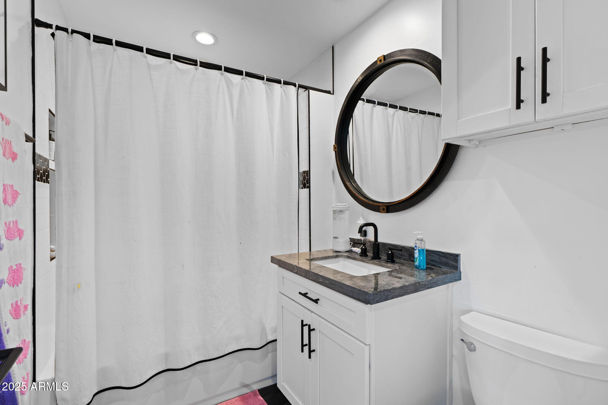 6835 East Peak View Road Scottsdale, AZ 85266 - Photo 90 of 107 a bathroom with a sink and a mirror