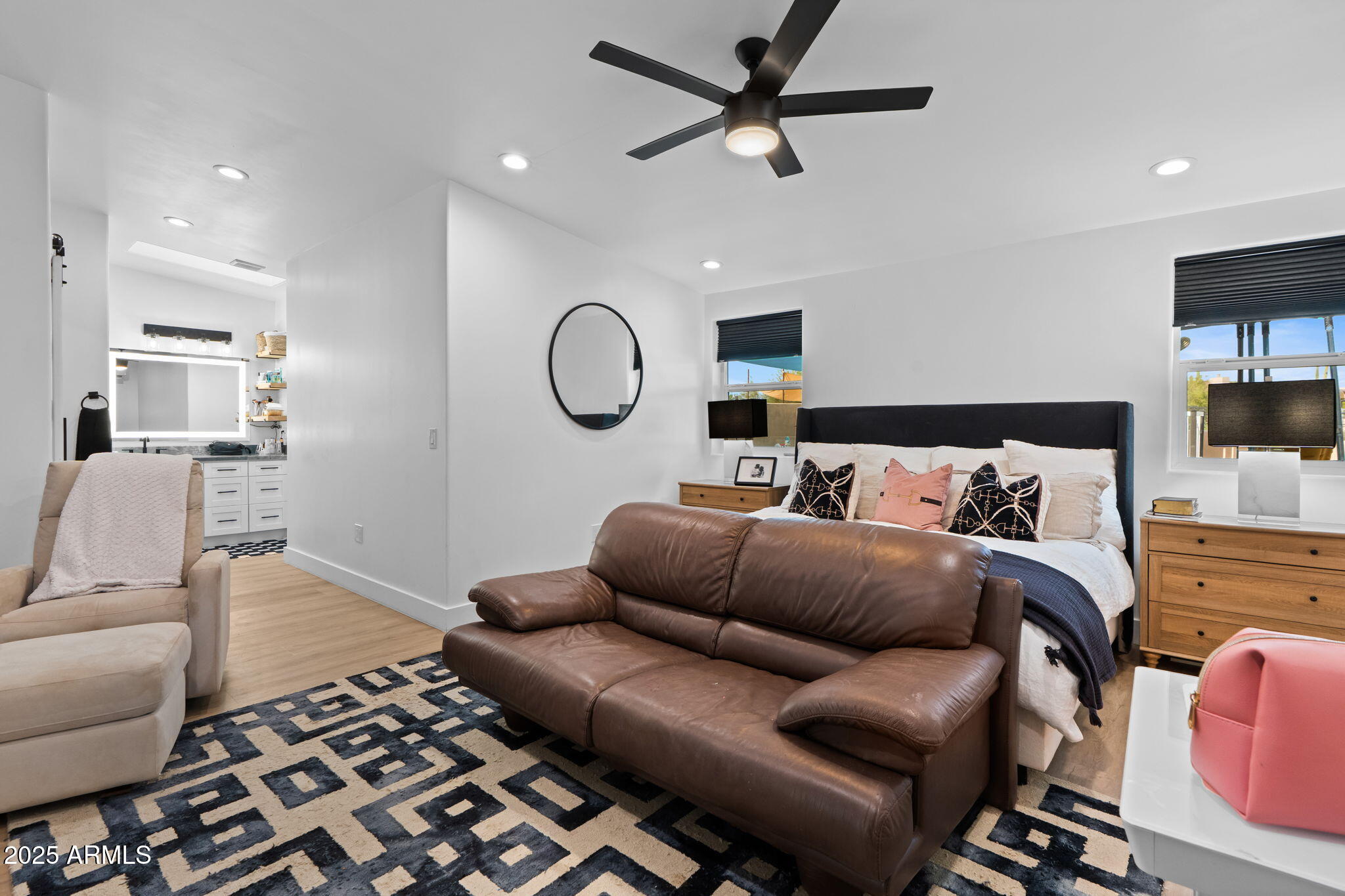 6835 East Peak View Road Scottsdale, AZ 85266 - Photo 99 of 107 a living room with furniture a ceiling fan and a rug