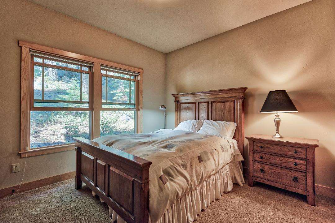 135 Alpine Meadows Road, Unit 32 Alpine Meadows, CA 96145 - Photo 14 of 20 a bedroom with a bed next to a window