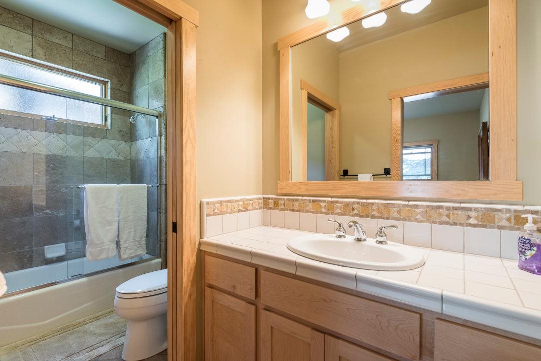 135 Alpine Meadows Road, Unit 32 Alpine Meadows, CA 96145 - Photo 15 of 20 a bathroom with a sink a toilet and shower