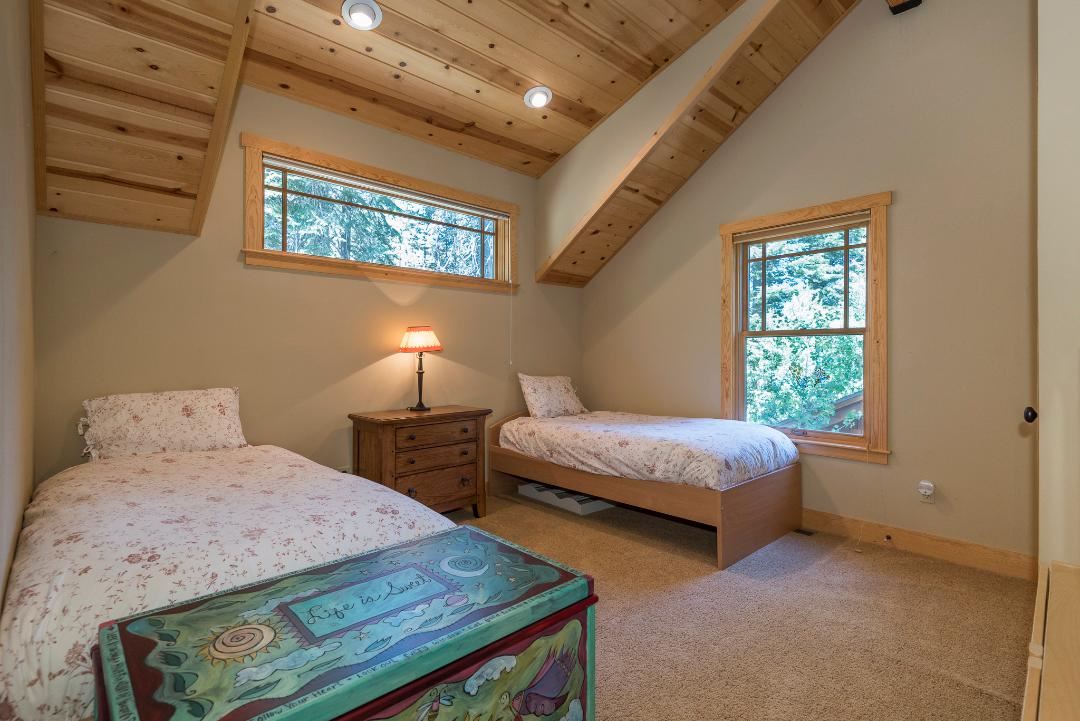 135 Alpine Meadows Road, Unit 32 Alpine Meadows, CA 96145 - Photo 16 of 20 a bedroom with double bed and a window