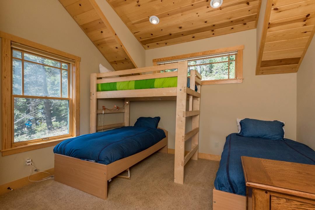 135 Alpine Meadows Road, Unit 32 Alpine Meadows, CA 96145 - Photo 17 of 20 a bedroom with furniture and a window