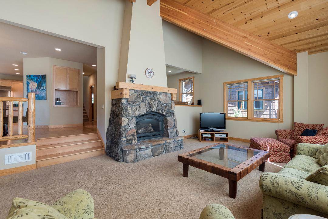 135 Alpine Meadows Road, Unit 32 Alpine Meadows, CA 96145 - Photo 3 of 20 a living room with furniture and a fireplace