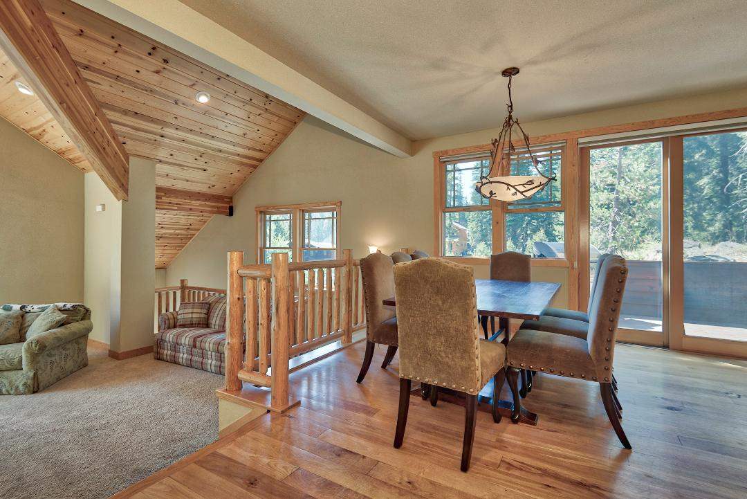 135 Alpine Meadows Road, Unit 32 Alpine Meadows, CA 96145 - Photo 4 of 20 a view of a dining room with furniture window and wooden floor