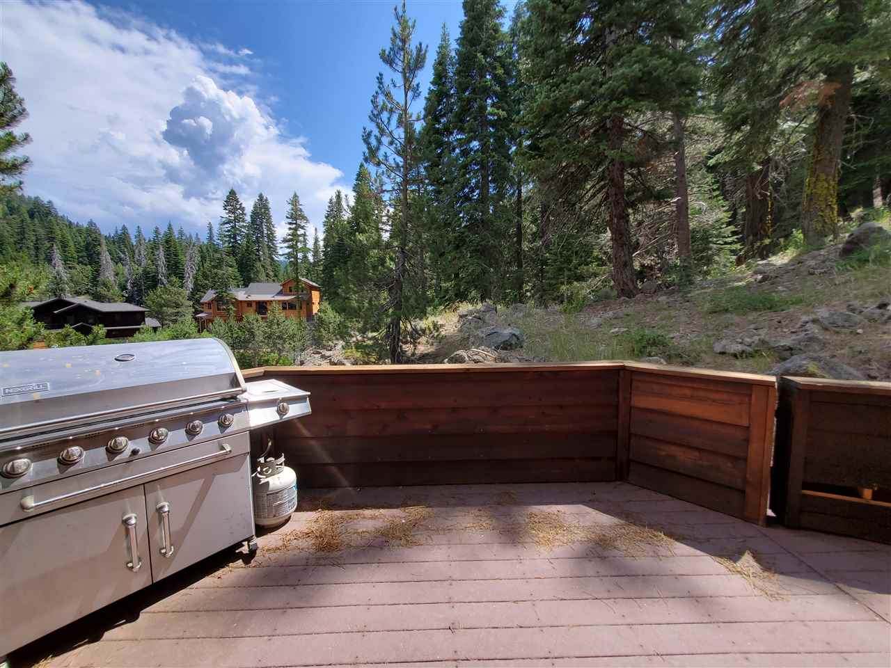 135 Alpine Meadows Road, Unit 32 Alpine Meadows, CA 96145 - Photo 6 of 20 a view of a yard with wooden floor and outdoor seating