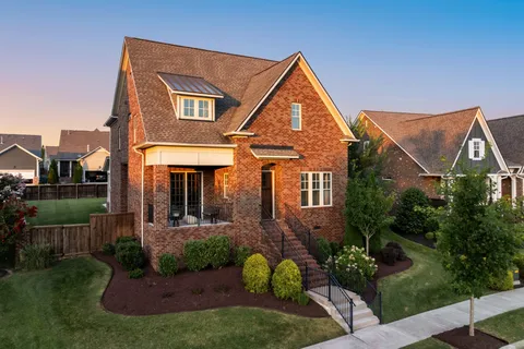 an aerial view of a house with a lake view
