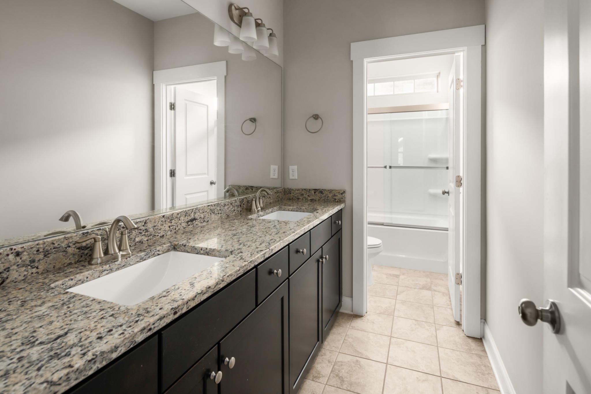 3210 Natoma Circle Thompson's Station, TN 37179 - Photo 39 of 63 a bathroom with a granite countertop sink and a mirror