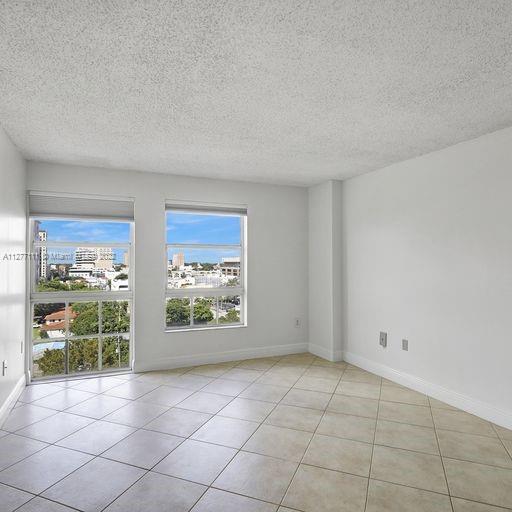 2351 Douglas Road, Unit 908 Miami, FL 33145 - Photo 15 of 37 a view of an empty room and window