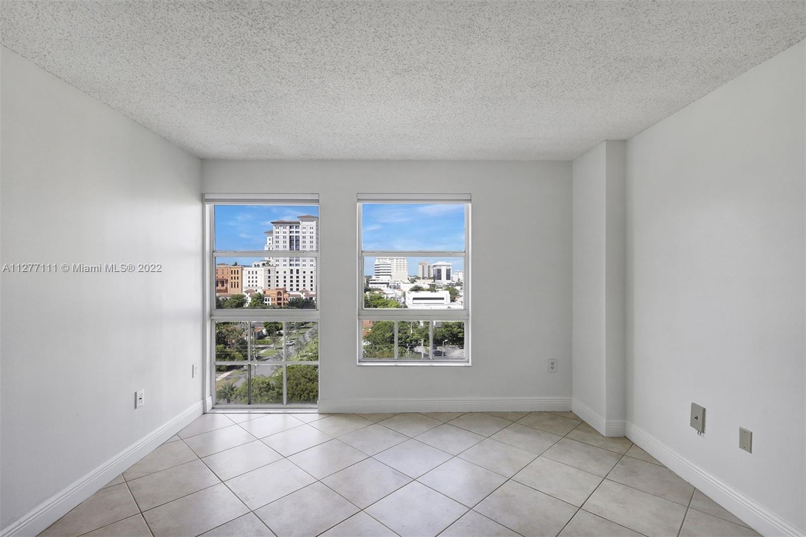2351 Douglas Road, Unit 908 Miami, FL 33145 - Photo 18 of 37 a view of an empty room with a window