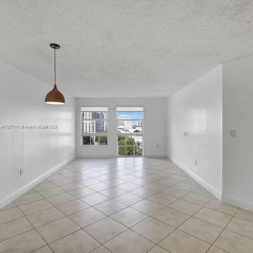 2351 Douglas Road, Unit 908 Miami, FL 33145 - Photo 2 of 37 a view of an empty room and window