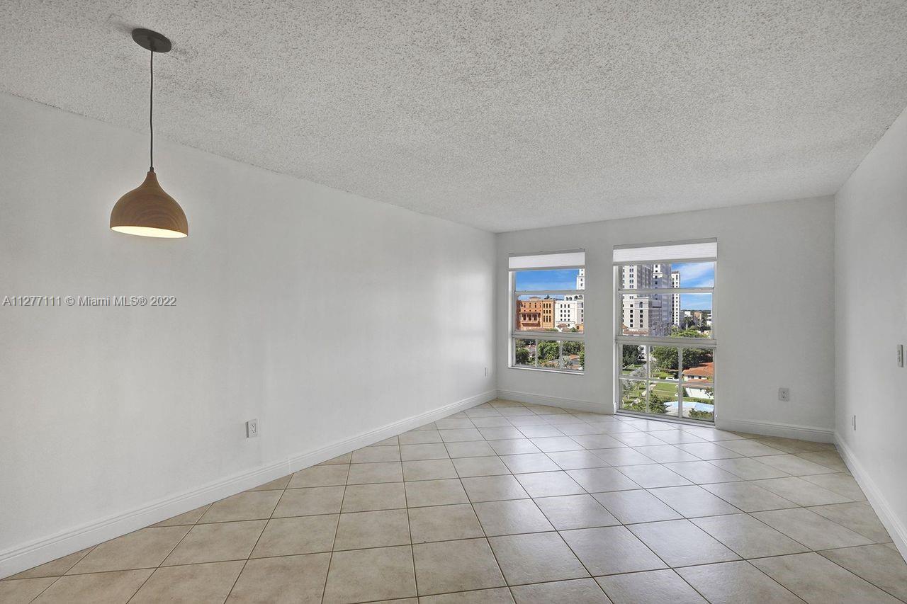 2351 Douglas Road, Unit 908 Miami, FL 33145 - Photo 3 of 37 a view of an empty room with a window