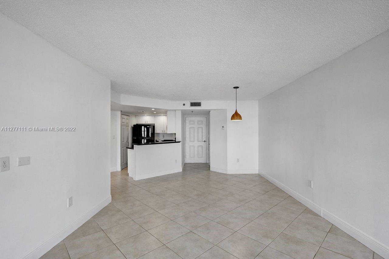 2351 Douglas Road, Unit 908 Miami, FL 33145 - Photo 4 of 37 a view of a kitchen with a sink