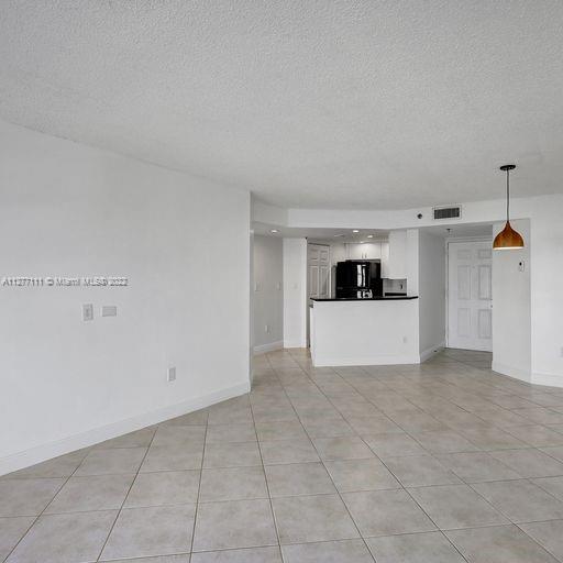 2351 Douglas Road, Unit 908 Miami, FL 33145 - Photo 8 of 37 a view of a kitchen with microwave and cabinets