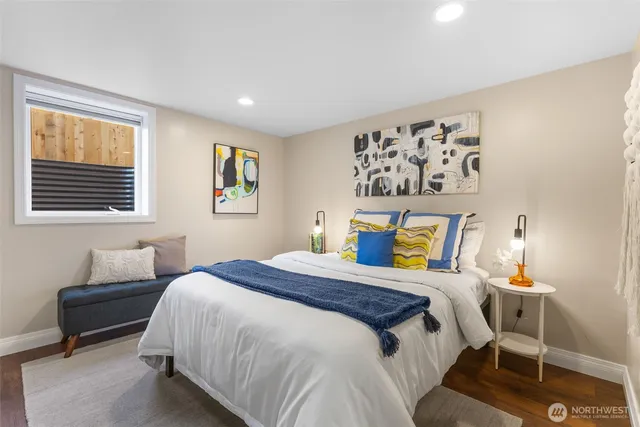 a bedroom with a bed and a window