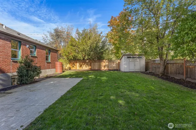 a front view of house with a garden