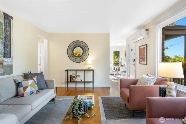 a living room with furniture and a clock