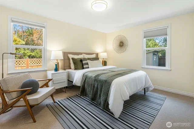 a bedroom with a bed and window