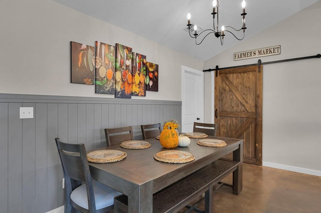 655 Buster Chatham Road Waco, TX 76705 - Photo 12 of 40 a view of a dining area with furniture and chandelier