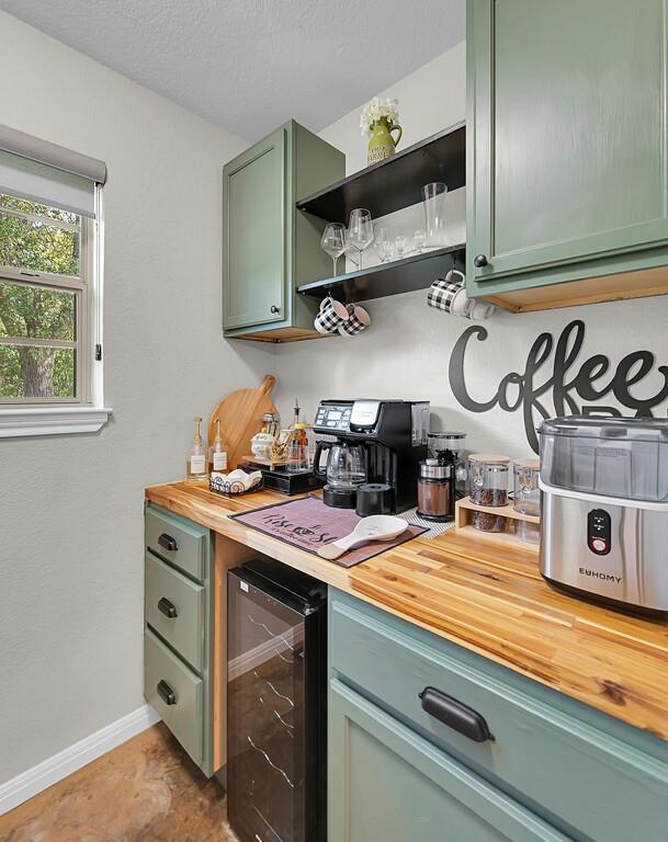 655 Buster Chatham Road Waco, TX 76705 - Photo 14 of 40 a kitchen with stainless steel appliances granite countertop a stove and a sink