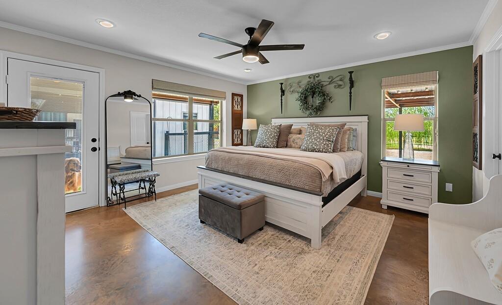 655 Buster Chatham Road Waco, TX 76705 - Photo 16 of 40 a living room with furniture large window and a flat screen tv