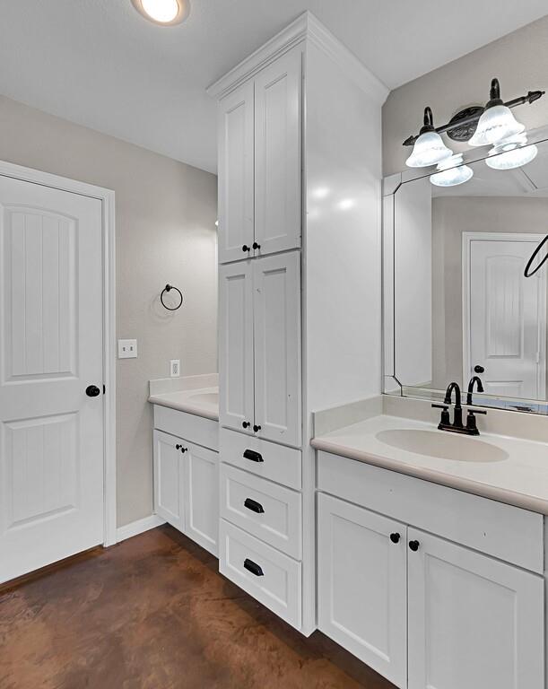 655 Buster Chatham Road Waco, TX 76705 - Photo 17 of 40 a bathroom with a sink vanity and mirror