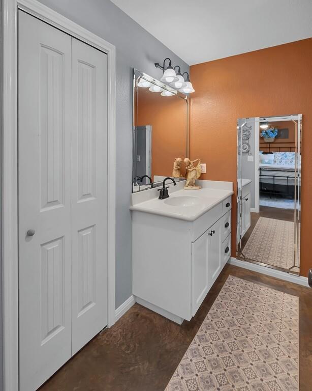 655 Buster Chatham Road Waco, TX 76705 - Photo 21 of 40 a bathroom with a sink and a mirror