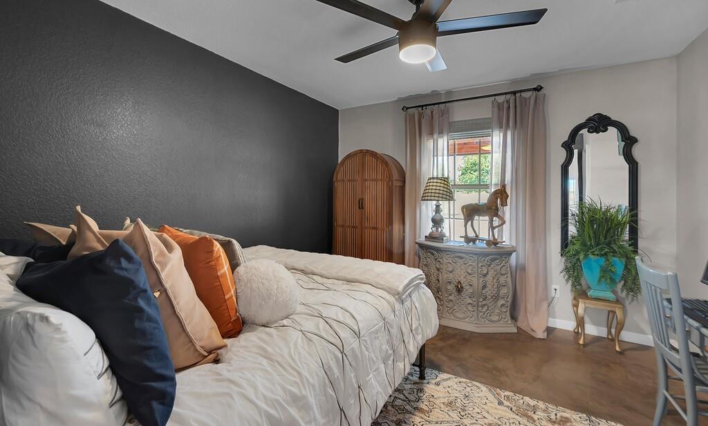 655 Buster Chatham Road Waco, TX 76705 - Photo 22 of 40 a bedroom with a bed and a mirror