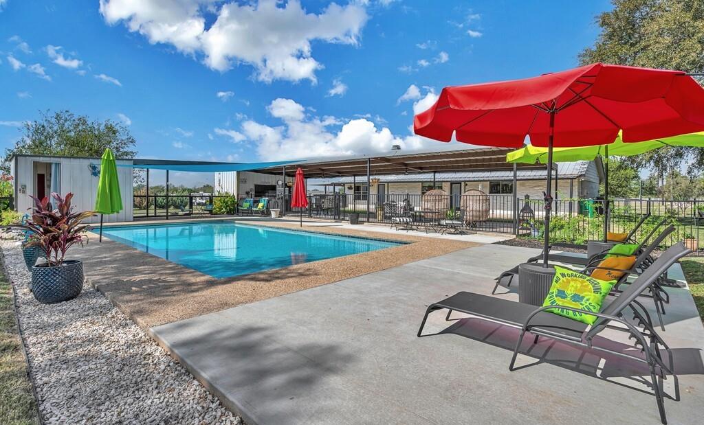 655 Buster Chatham Road Waco, TX 76705 - Photo 27 of 40 a swimming pool with outdoor seating and yard