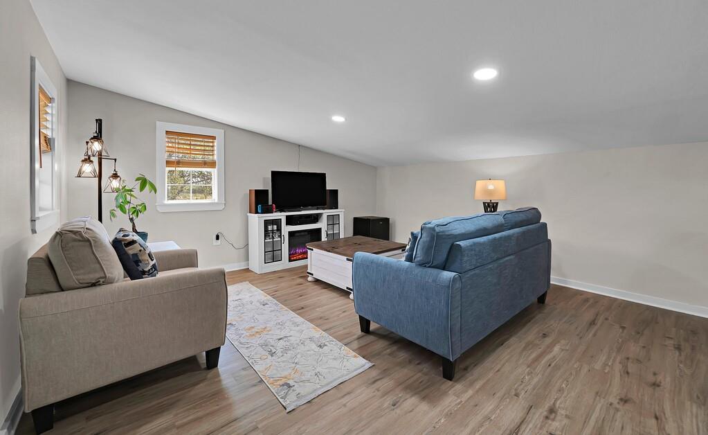 655 Buster Chatham Road Waco, TX 76705 - Photo 36 of 40 a living room with furniture and a flat screen tv