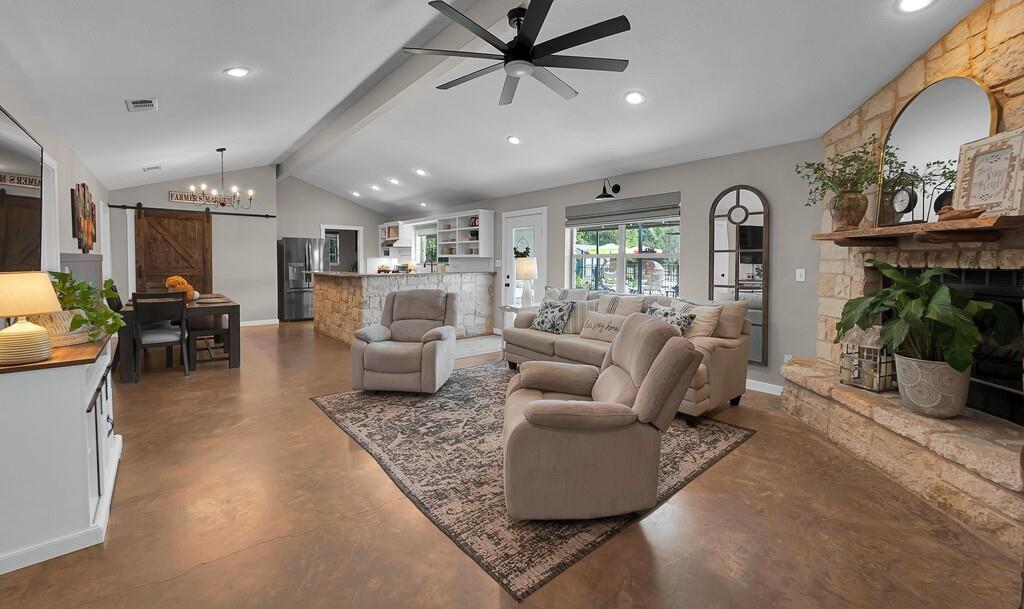 655 Buster Chatham Road Waco, TX 76705 - Photo 6 of 40 a living room with furniture and a chandelier