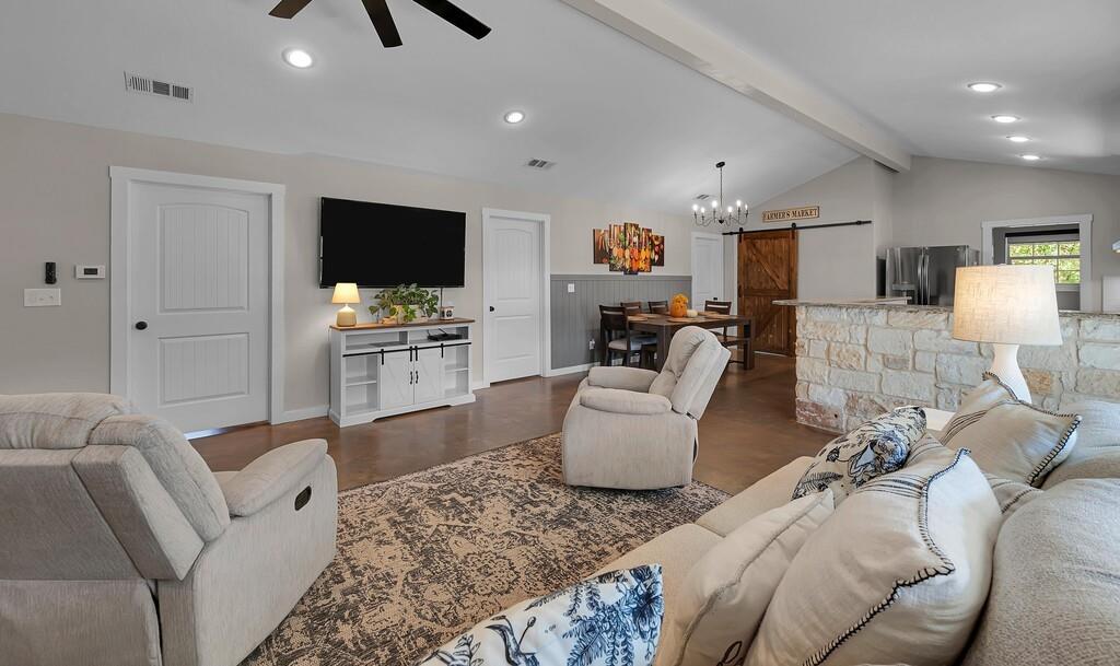 655 Buster Chatham Road Waco, TX 76705 - Photo 7 of 40 a living room with furniture and a flat screen tv