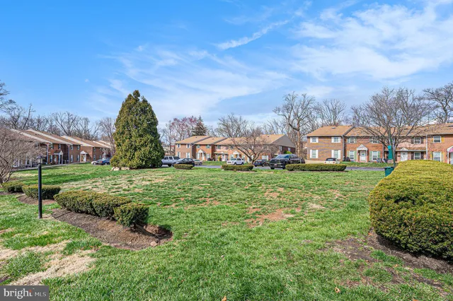 a view of a garden in front of a house