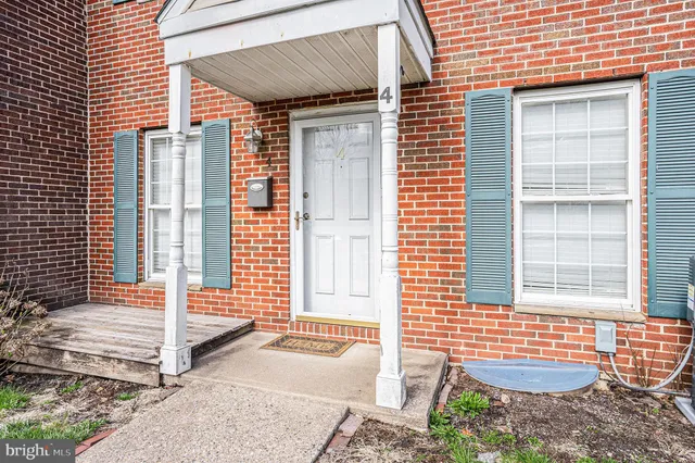 a front view of a house with large windows