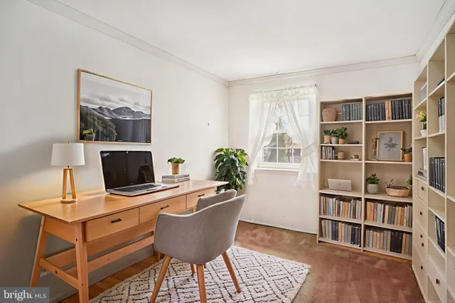 a workspace with furniture and book shelf