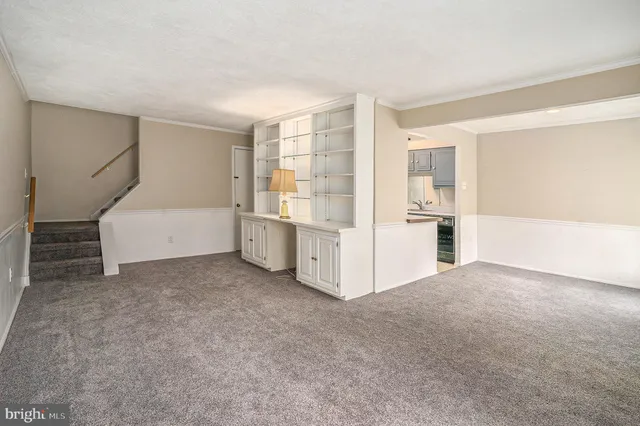 a view of an empty room with a cabinet