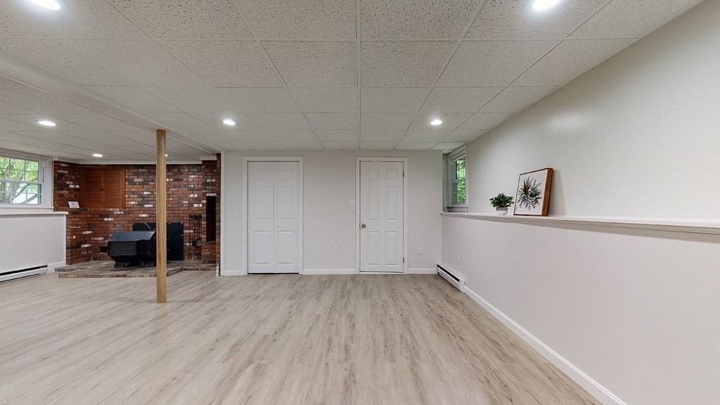 34 Heritage Road Sutton, MA 01590 - Photo 22 of 33 a view of a room with wooden floor and furniture
