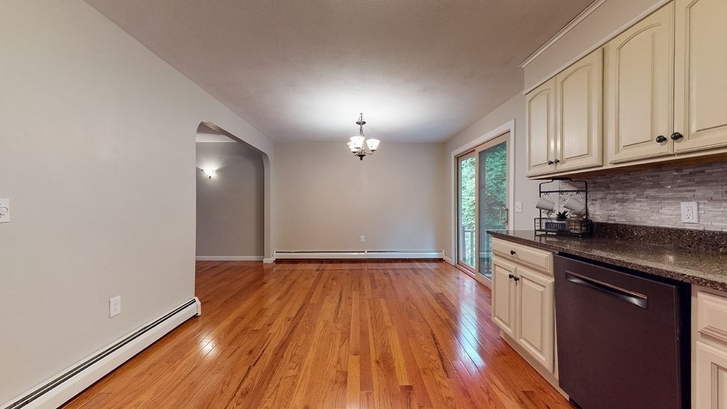 34 Heritage Road Sutton, MA 01590 - Photo 6 of 33 a view of a kitchen with wooden floor and a sink