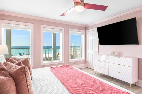 a bedroom with a bed and a flat screen tv