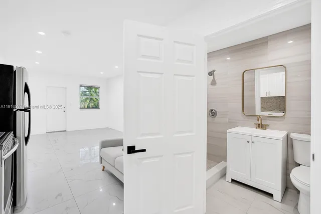 a spacious bathroom with a bathtub sink and toilet